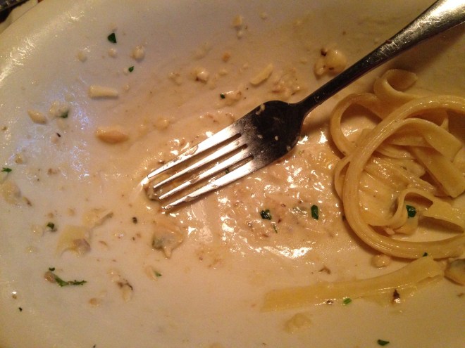 empty dish of fettuccine with white clam sauce